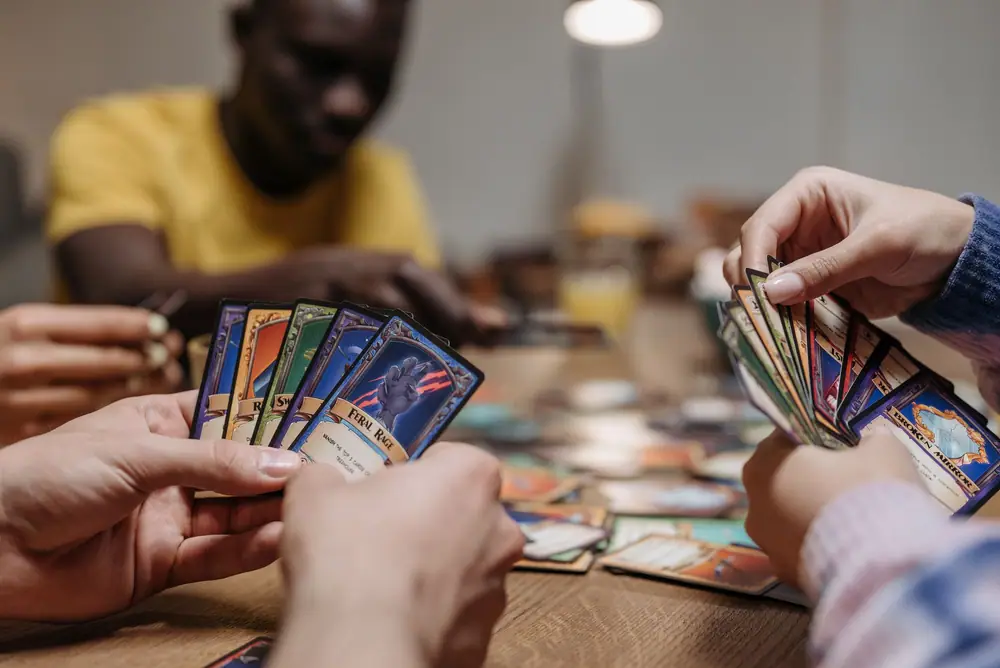 Players studying their cards during a relaxed evening card game